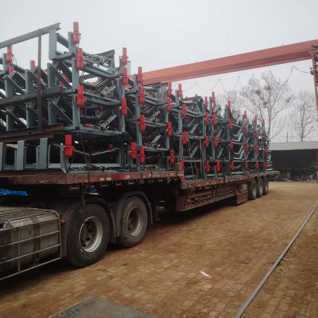 Hydraulic belt tracking devices prepared for delivery.