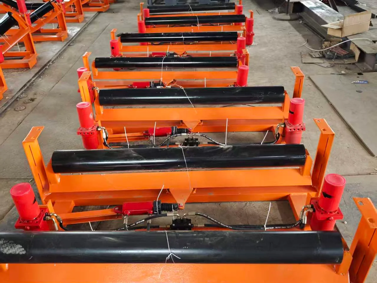Hydraulic belt tracking systems arranged during workshop production