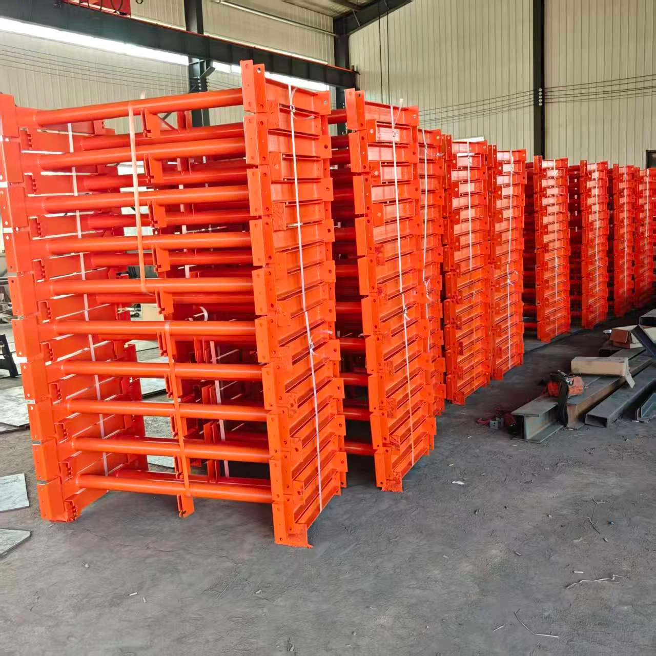 Orange conveyor support frames prepared for delivery